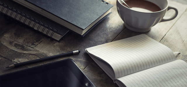 Notebooks and coffee on the table